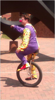 clown Clown riding a unicycle in a psych experiment