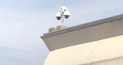 Security camera on top of building