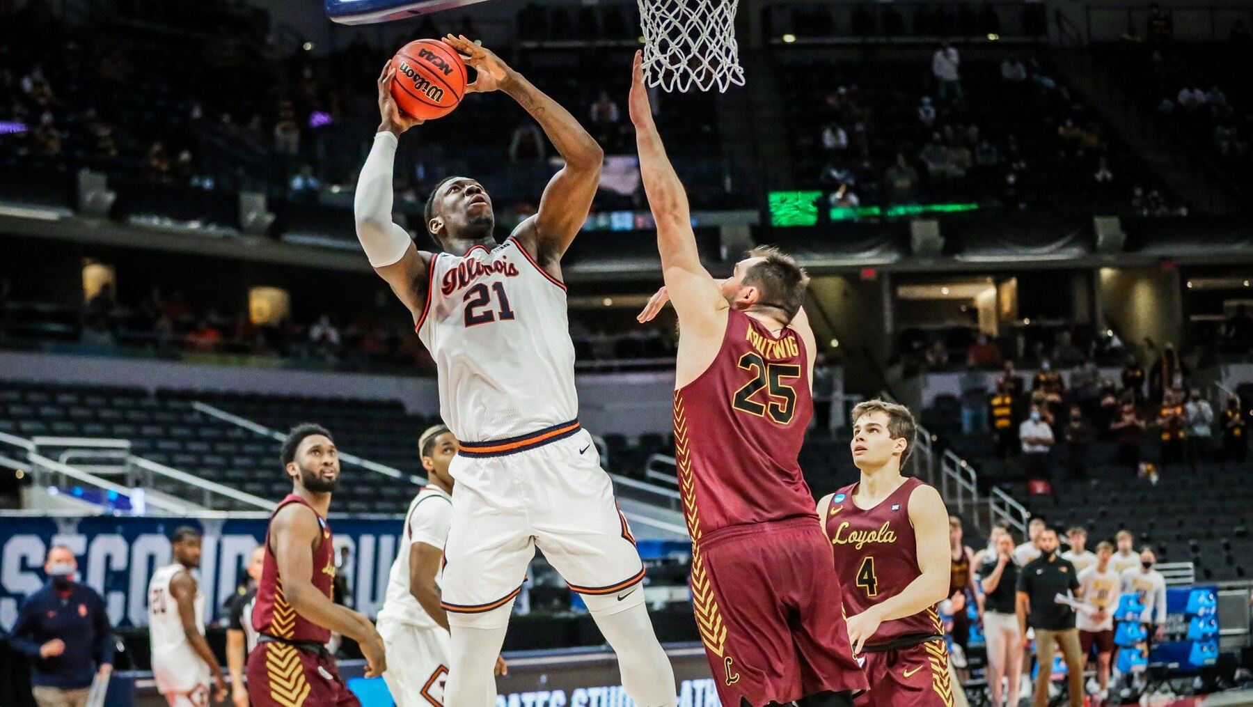 Kofi Cockburn goes up for a shot under the basket against Loyola