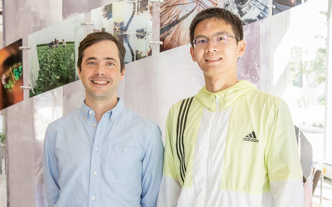 Chris Brooke, an associate professor of microbiology (left) with lead author and graduate student Tongyu Liu. Photo by Julia Pollack