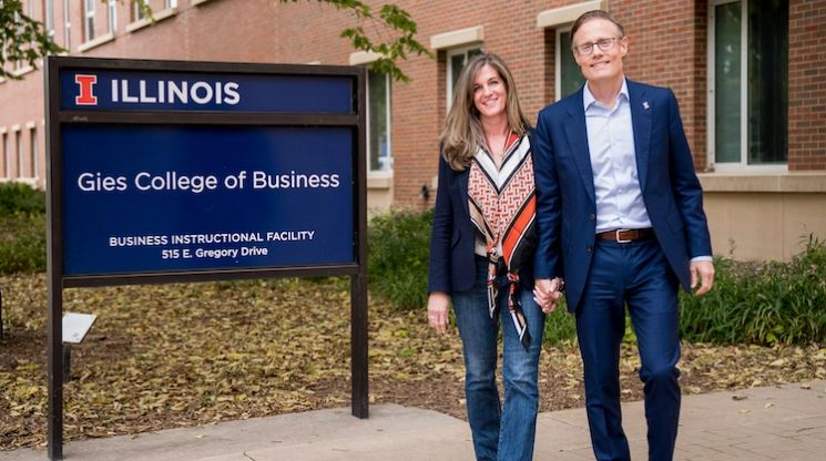 Larry Gies, 56, and his wife, Beth Gies, 55, outside the Gies College of Business at the University of Illinois