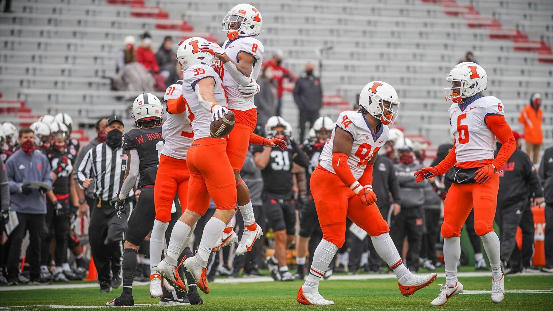 players celebrating on field in Nebraska