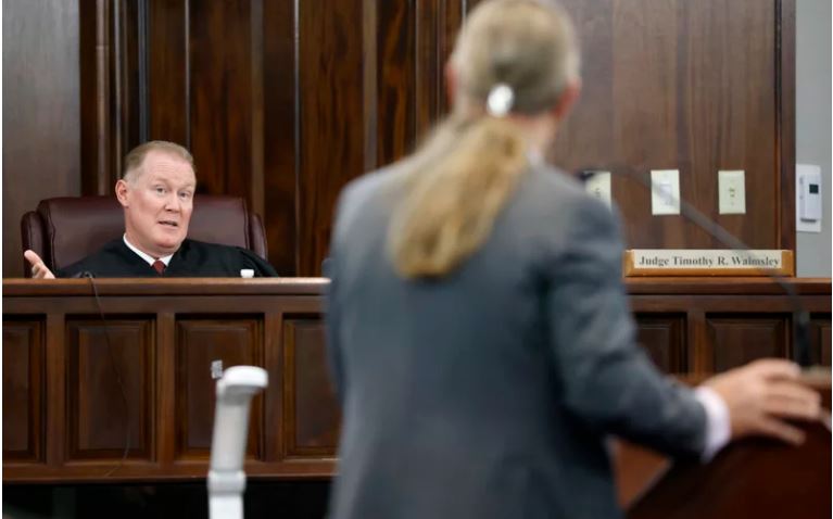 Judge Timothy Walmsley speaks to defense attorney Franklin Hogue during the jury selection process in the trial of the men charged with killing Ahmaud Arbery, at the Glynn County Superior Court in Brunswick, Ga., on Oct. 27. Pool/Getty Images