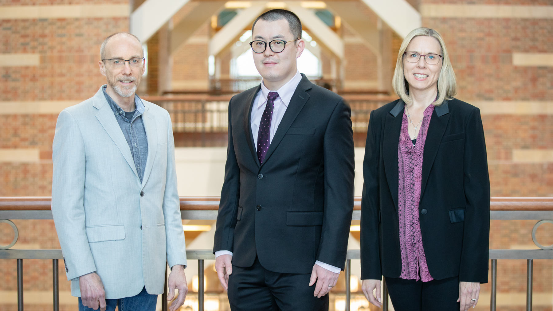 Beckman Institute director Jeffrey Moore, left, postdoctoral researcher Hai Qian and materials science and engineering head Nancy Sottos. Photos by L.B. Stauffer