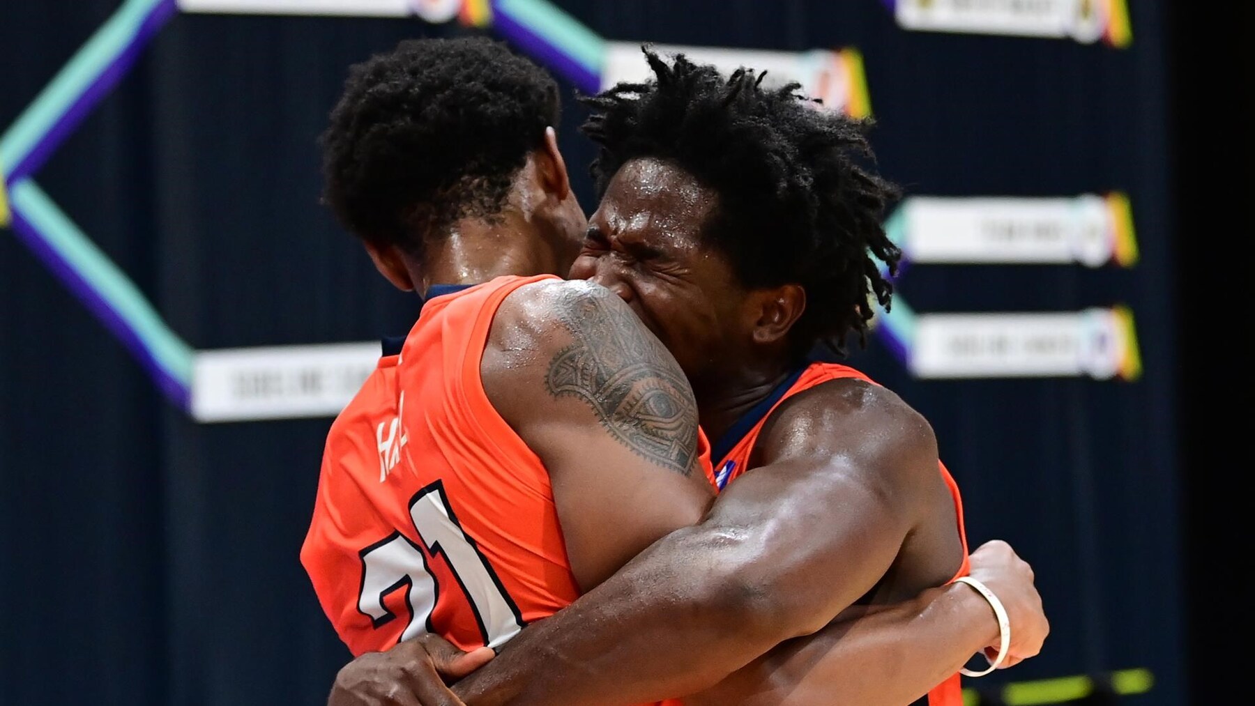 Andres Feliz and Malcolm Hill embrace after the victory.