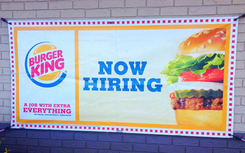 Burger King 'now hiring' sign. Photo via Flickr by Mike Mozart