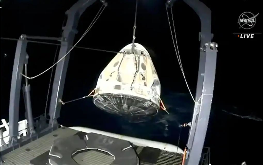 The SpaceX Dragon capsule is retrieved from the Gulf of Mexico near the Florida Panhandle early Sunday morning. (AP still from NASA video)