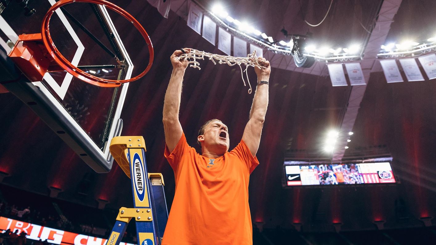 Coach Brad Underwood cuts down a basketball net in a post-game celebration