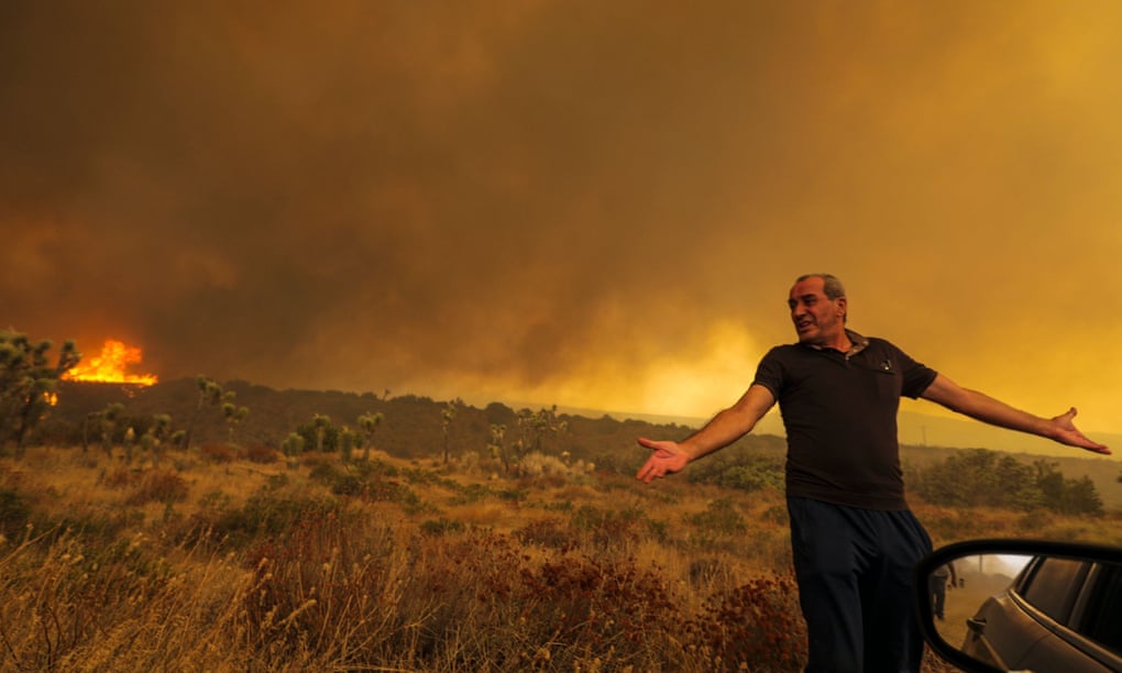 A frustrated Mike Gregoryan is asked to leave his home as Bobcat fire rages in Juniper Hills, Little Rock, California, earlier this month. Photograph: Irfan Khan/Los Angeles Times/Rex/Shutterstock