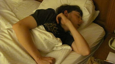 stock image of a young man sleeping. Wikimedia Commons