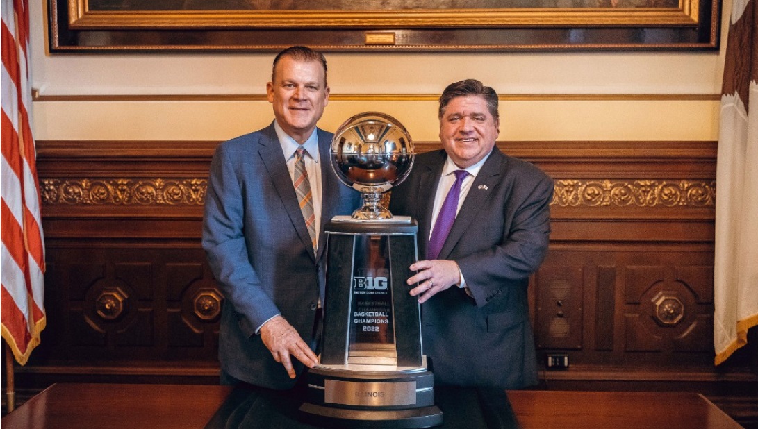 Men's Basketball head coach Brad Underwood poses with Big Ten trophy and Governor J. B. Pritzker