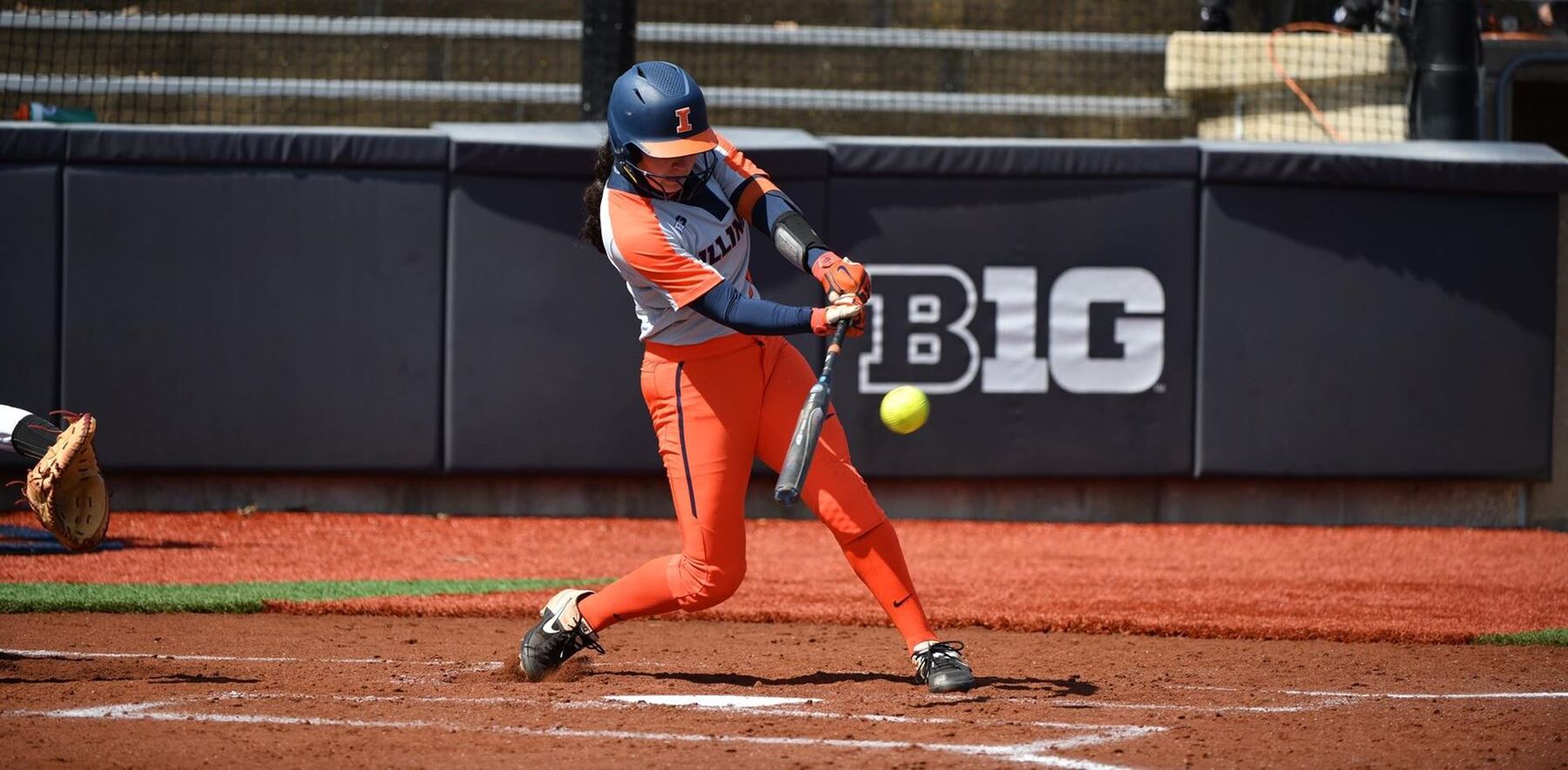 an Illini player's swing capture just before she connects with the ball