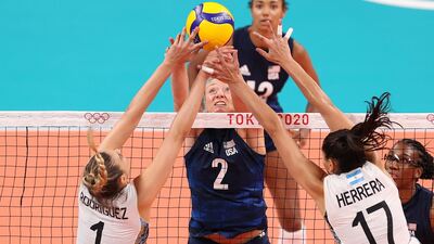former Illini leaps at the net while playing for the U.S. Olympic Volleyball team