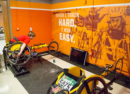 image showing a new paint job and photographs and motivational slogans on the walls of the paralympic training facility.