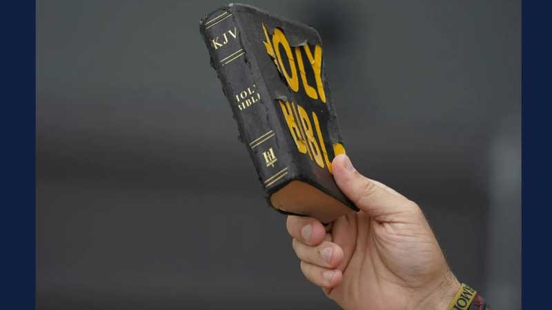 A protester holds up a copy of the Bible during a rally in Jackson, Miss., on July 2, 2022.Rogelio V. Solis, Associated Press