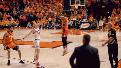 Illini player shoots a jump shot from three point territory against the Buckeyes on Thursday night
