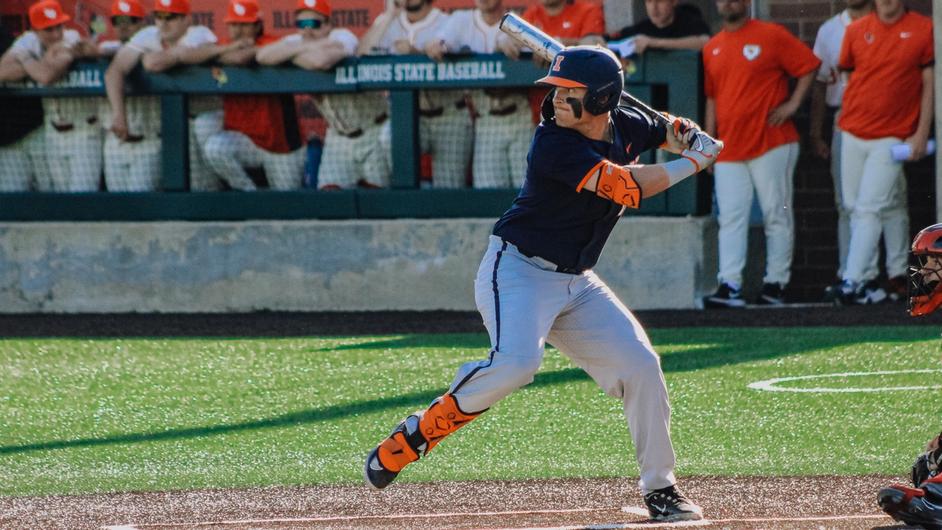 An Illini batter looks intensely at an incoming pitch