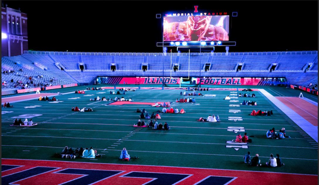 U of I students practice social distancing while watching a movie at Memorial Stadium. Photo by Fred Zwicky