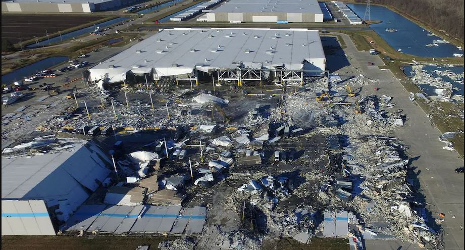 The Amazon distribution center’s toppled south wall on Dec. 11, a day after a tornado struck the facility. Six people died, all on the south side of the building. (Drone Base/Reuters)