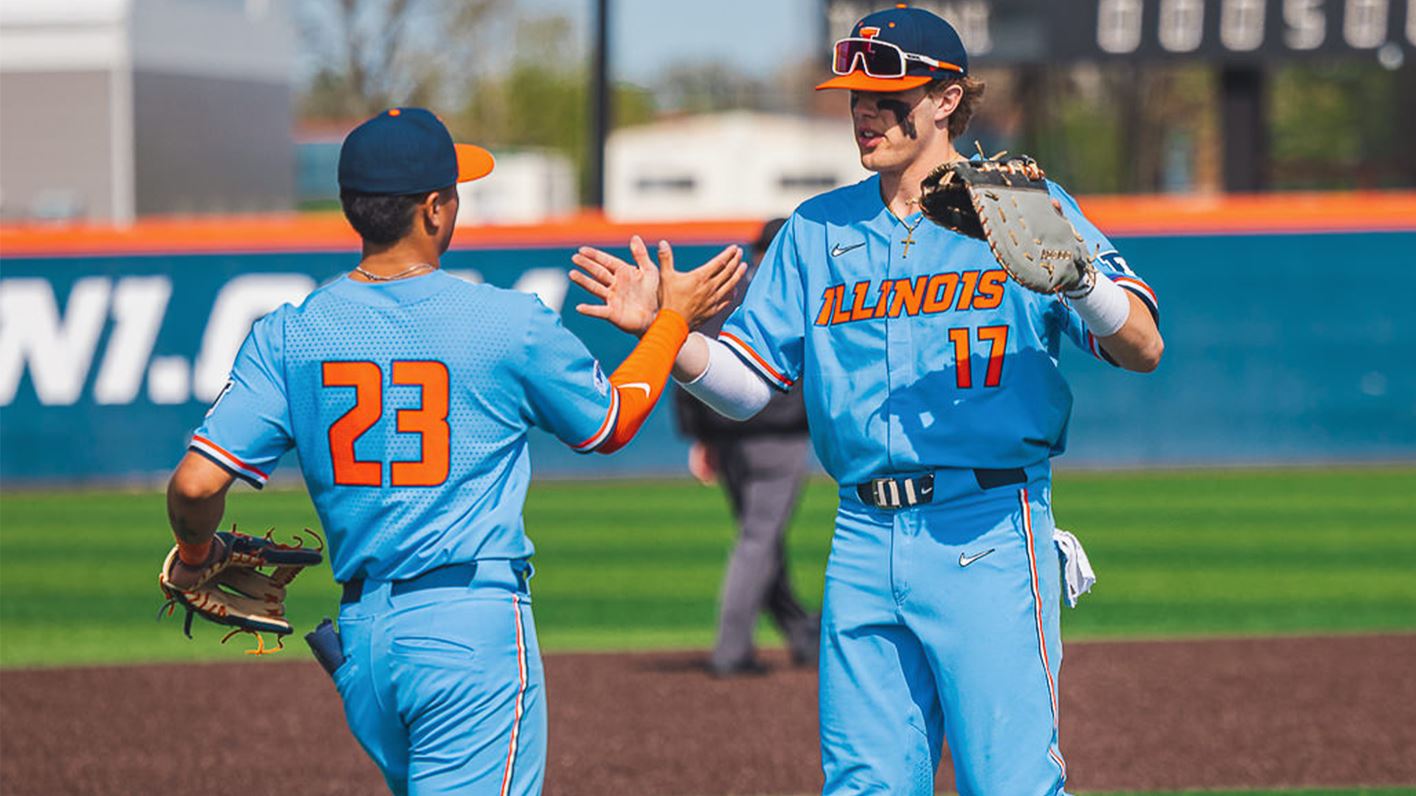 Two Illini infielders 'high five' in celebration of a win last weekend against Miami (OH)
