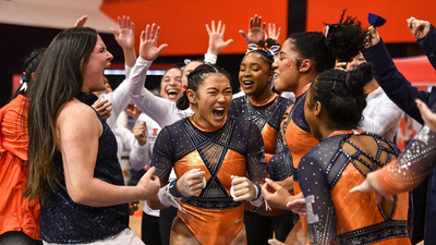 Gymnast Mia Takekawa celebrates with teammates