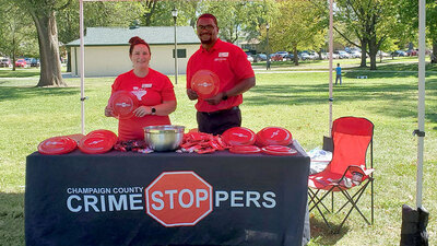 Crimestoppers booth at a local event. Photo courtesy of Champaign County Crimestoppers