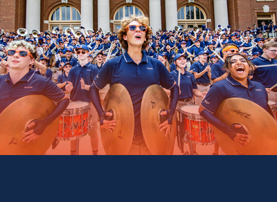 members of the Marching Illini on the steps of Foellinger Hall
