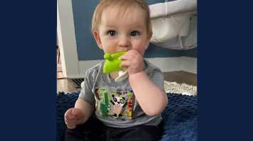 A specially-designed LittleBeats shirt on an infant