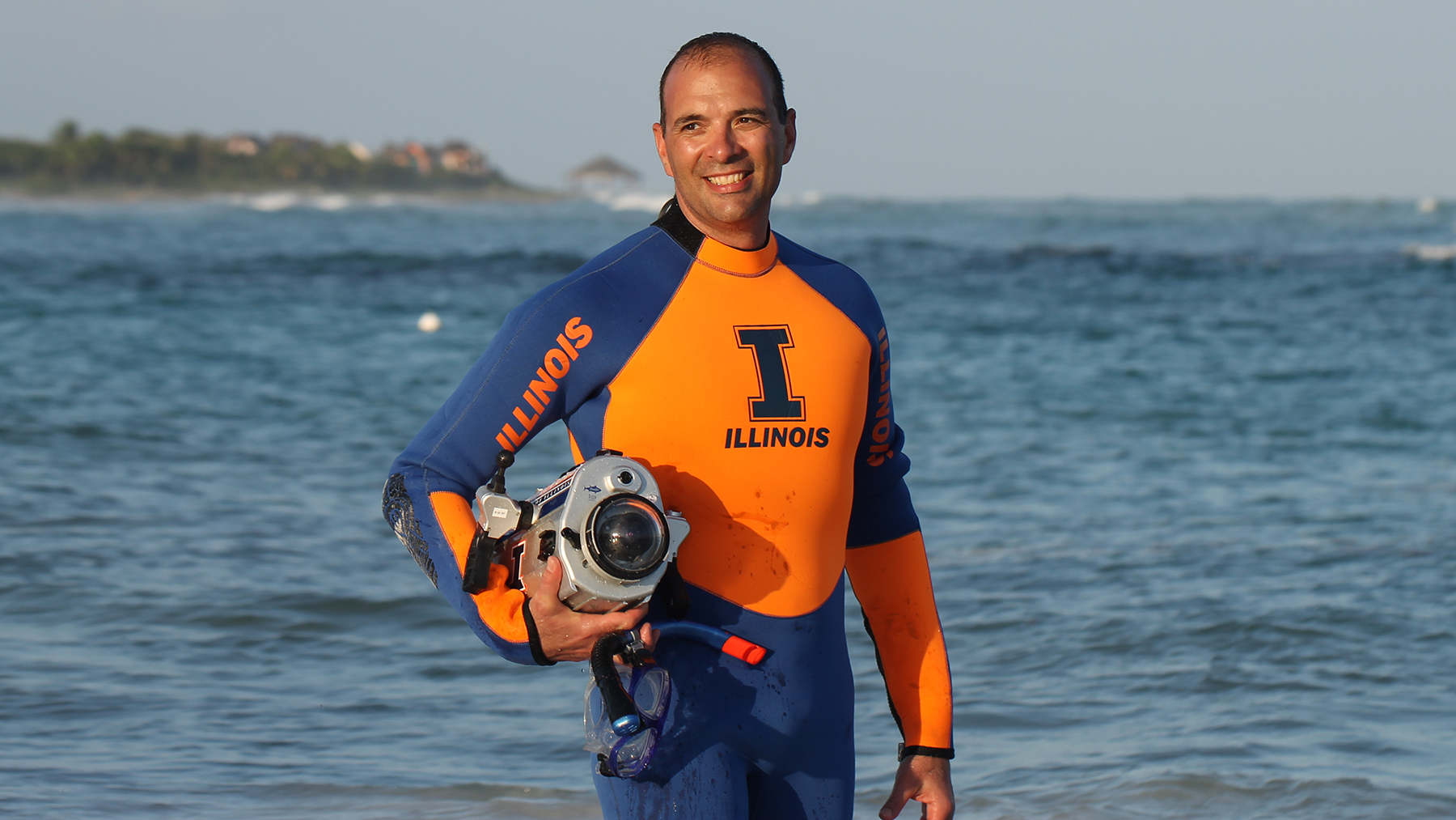 Deep-sea operations pose significant challenges, such as immense pressure, which restrict the availability of suitable technologies for deep-water search missions, said professor Viktor Gruev, who is an expert in underwater geolocation technology.  He is shown hear standing oceanside wearing a wet suit