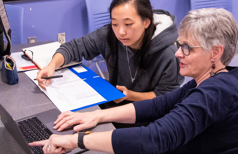 Lynn Burdick works with a new teacher