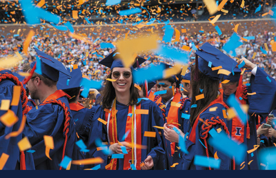 Graduates celebrate during the confetti drop at UI Commencement.