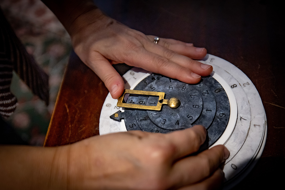 A decoder wheel is one of the tools the players use in the escape room. Photo by Fred Zwicky