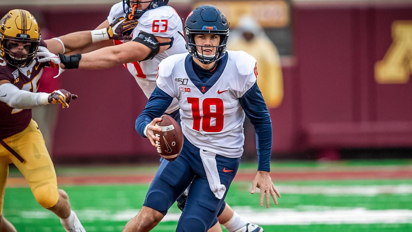Quarterback Brandon Peters scrambles with the ball in a previous game against Minnesota