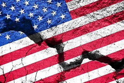 American flag painted on cracked concrete. Stock image.