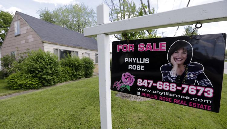 In this Sunday, June 16, 2013 photo, a home is for sale in Glenview, Ill.  AP Photo/Nam Y. Huh