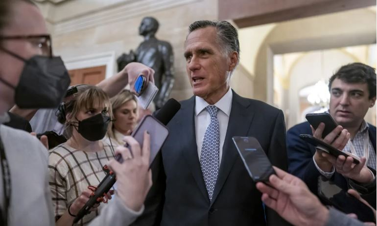 Senator Mitt Romney, who supports the Respect for Marriage Act, speaks to reporters in a file photo