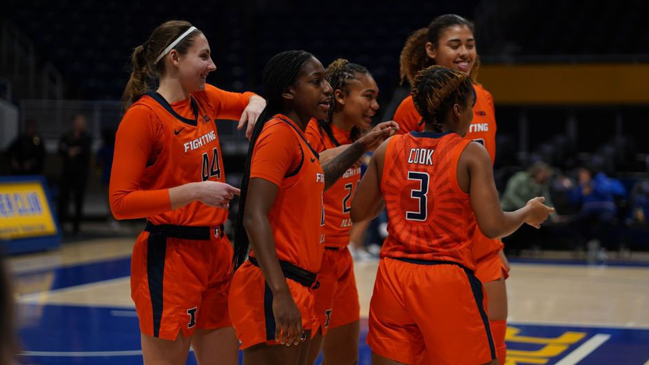 Illini players are all smiles on the Pittsburgh Panthers' court after their victory Wednesday evening