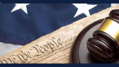 stock image shows parts of U.S. flag, constitution, and gavel