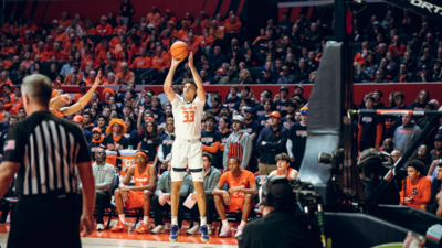 Coleman Hawkins elevates for a three-point jump shot in the Illini victory over Syracuse on November 29, 2022