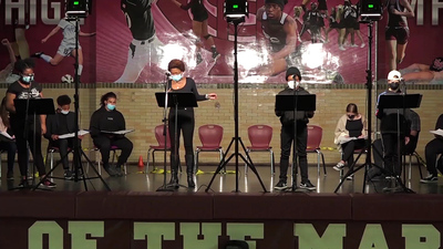 High school students perform a reading of Xtigone at Champaign Central High School