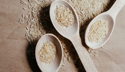 rice on wooden spoons. stock photo via Pexels