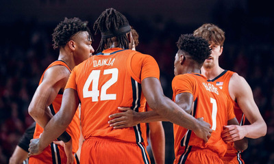 Illini team huddles on the court during a game