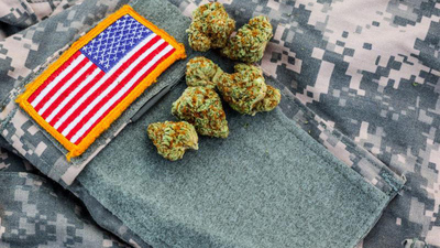 marijuana buds on the sleeve of a military uniform with American flag patch