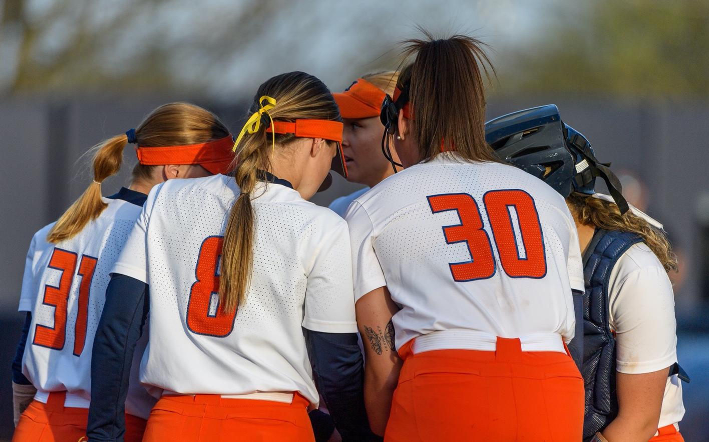 Infielders meet on the pitchers mound during a previous Illini Softball contest