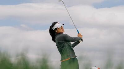 Crystal Wang watches an iron shot in a previous competition