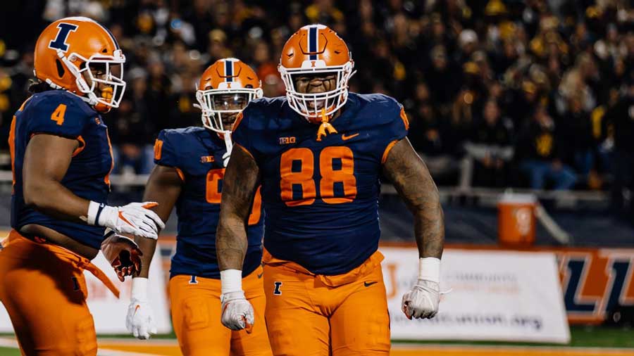 defensive linemen for the Illini react after a tackle for loss in the Oct. 8 victory over Iowa
