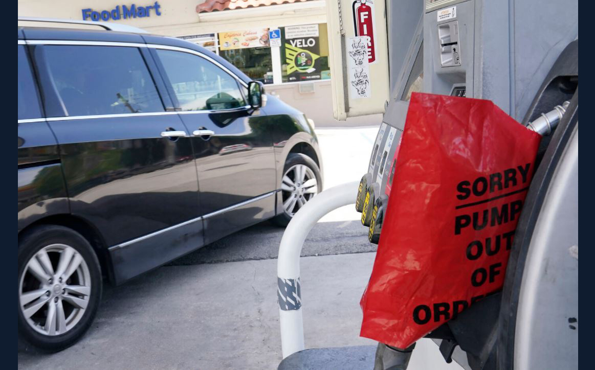A customer drives from a Chevron station after it ran out of gasoline, Wednesday, May 12, 2021, in Miami.  (AP Photo/Marta Lavandier)