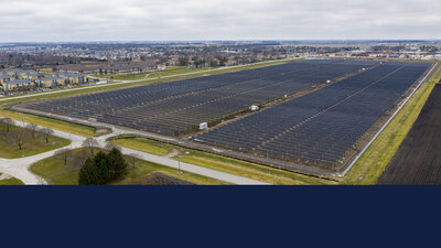 large field of solar panels at the U of I's Solar Farm two-point-oh.