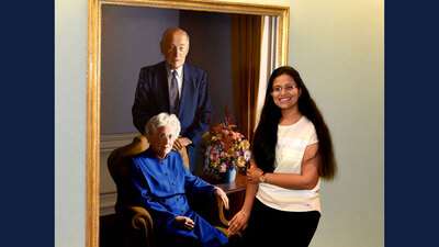 Mittal poses beside a portrait of Arnold and Mabel Beckman, two of the many mentors who provided inspiration throughout her Ph.D. program.