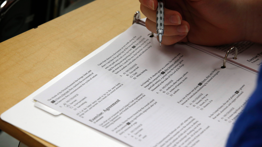 A student looks at questions during a college test preparation. (AP Photo/Alex Brandon)